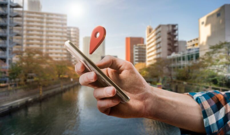 side-view-hand-holding-smartphone_23-2149764138